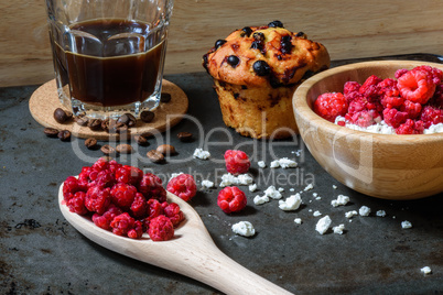 Cottage cheese with raspberries, coffee and muffin for breakfast