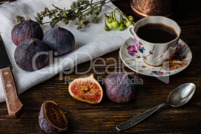 Seasonal and exotic fig with coffee cup for breakfast