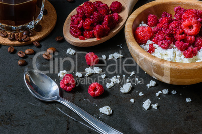 Cottage cheese with raspberries and coffee in a cup for breakfast