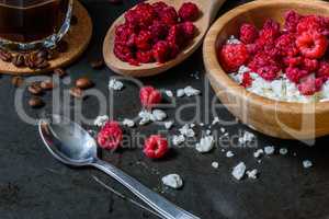 Cottage cheese with raspberries and coffee in a cup for breakfast