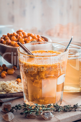 sea buckthorn honey ginger mix in glass with ingredients.