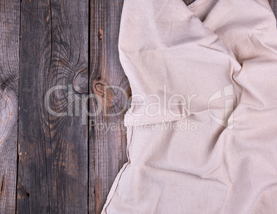 textile dishcloth on a gray wooden background from old boards