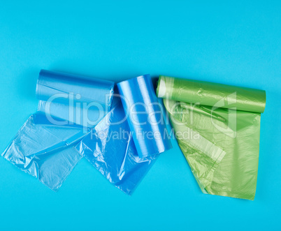 three rolled up rolls with plastic garbage bags
