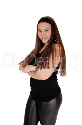 Happy young teenager girl standing in the studio