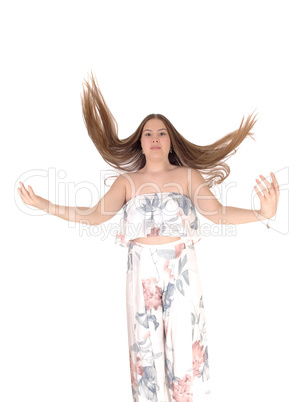 Teenage girl jumping with her hair flying