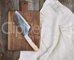 empty old brown wooden cutting board and knife