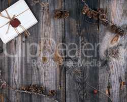 tied up with rope old paper postcards on a gray wooden backgroun