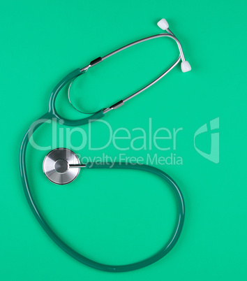 medical stethoscope on green background