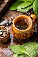 Herbal tea on wooden background