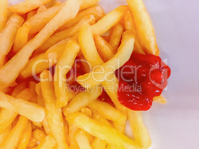 Close-up view of french fries with tomato ketchup sauce