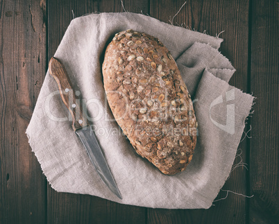 baked oval bread made from rye flour with pumpkin seeds