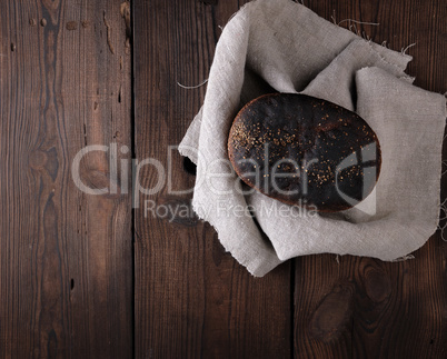 baked rye bread on a gray linen napkin