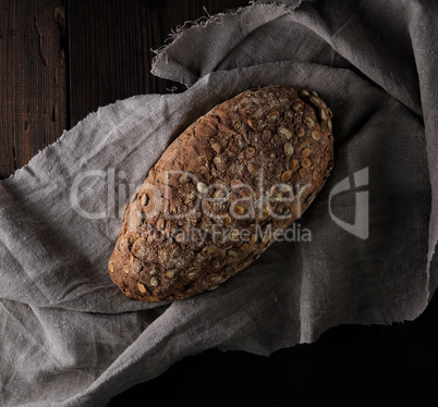 baked oval bread made from rye flour with pumpkin seeds