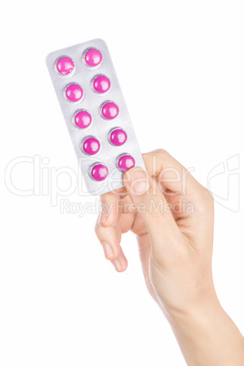 Woman hand holding pills tablet