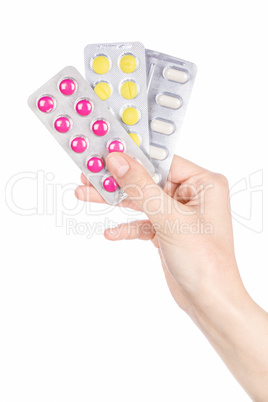 Woman hand holding pills tablet