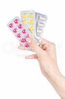 Woman hand holding pills tablet