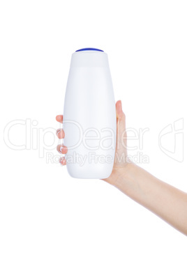 White bottle of shower gel lotion cream in hands