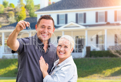 Happy Couple With New House Keys In Front Beautiful House