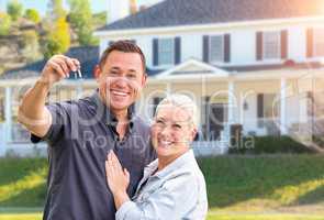 Happy Couple With New House Keys In Front Beautiful House