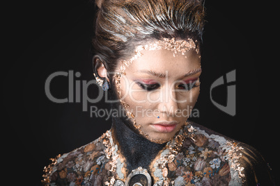 Portrait a girl with Golden icon painting makeup