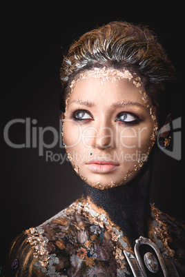 Portrait a girl with Golden icon painting makeup