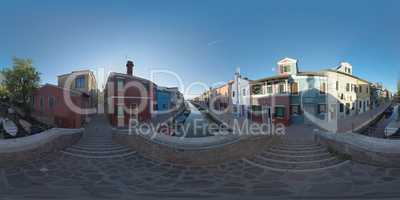 360 VR Townscape of Burano. Rustic scene with colored houses and boats in canal