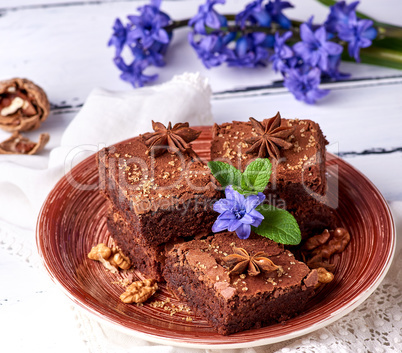 chocolate brownie pie in a ceramic brown plate