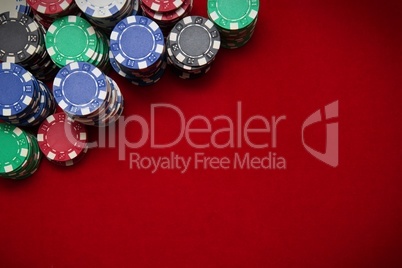 Poker chips on red background