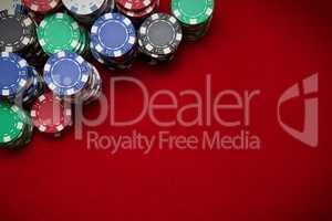 Poker chips on red background