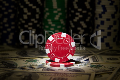 Red poker Chip at dollar background;