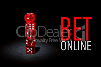 Red dices for gambling on a black background with text BET ONLINE