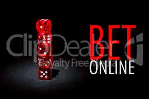 Red dices for gambling on a black background with text BET ONLINE