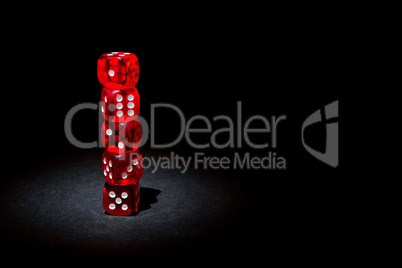 Red dices for gambling on a black background