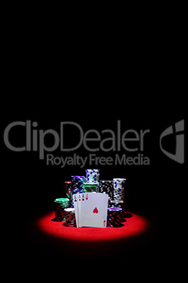 Four Aces with chip stack on red Table VERTICAL