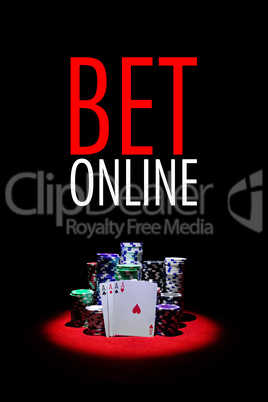 Four Aces with chip stack on red Table with text BET ONLINE