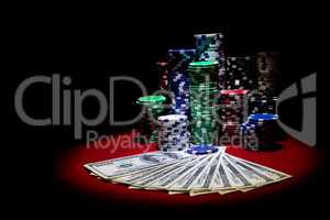 Dollars and poker chips on red casino table