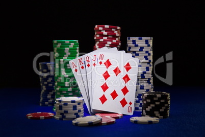 The best poker hand, royal flush with stuck of chips