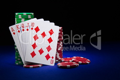 The best poker hand, royal flush with stuck of chips