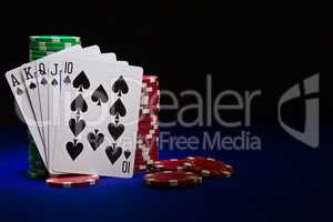 The best poker hand, royal flush with stuck of chips