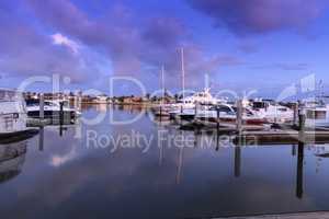 Dawn over the boats in Esplanade Harbor Marina in Marco Island,