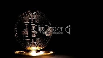 Gold bitcoin isolated on black background