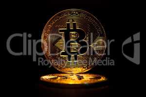 Gold Bitcoin isolated on black background