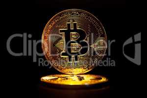 Gold Bitcoin isolated on black background