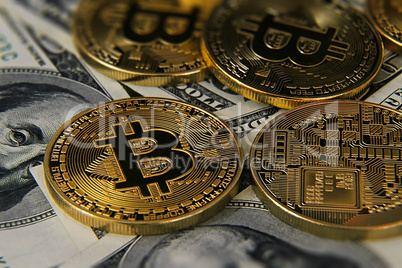 Bitcoins and dolalrs on table