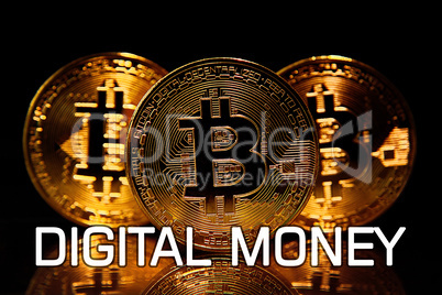 Bitcoins isolated on black with text DIGITAL MONEY