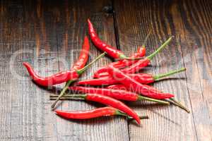Pile of Mexican chili peppers on wooden background