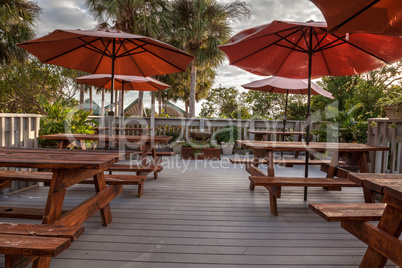 Picnic tables and umbrellas on a beach on Marco Island