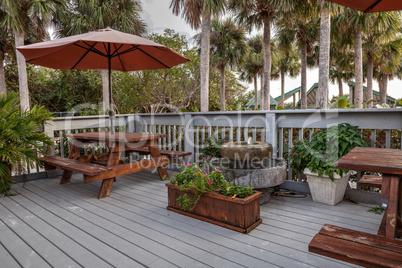 Picnic tables and umbrellas on a beach on Marco Island