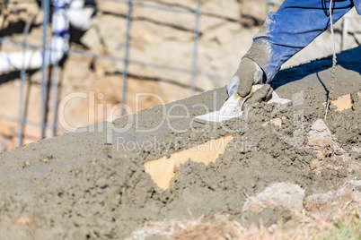 Pool Construction Worker Working With Wood Float On Wet Concrete