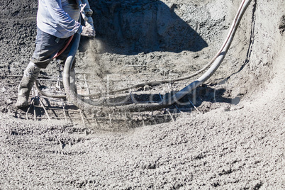 Pool Construction Worker Shooting Concrete, Shotcrete or Gunite